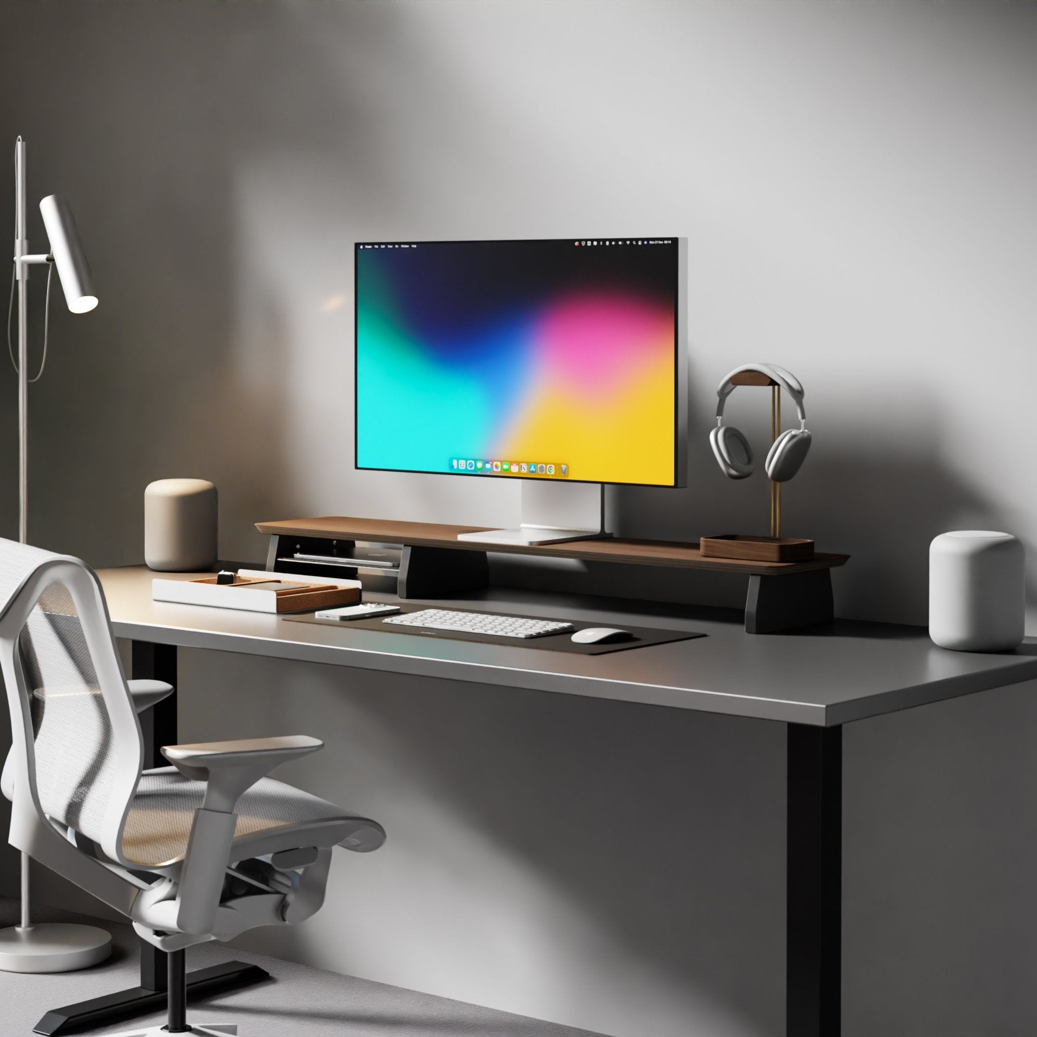 modern home office with grey desk and Raico Desk Shelf in Walnut. The desk is kept organised with  Raico Walnut Headphone Stand, and a leather desk desk mat so you can hideaway ur keyboard and mouse 