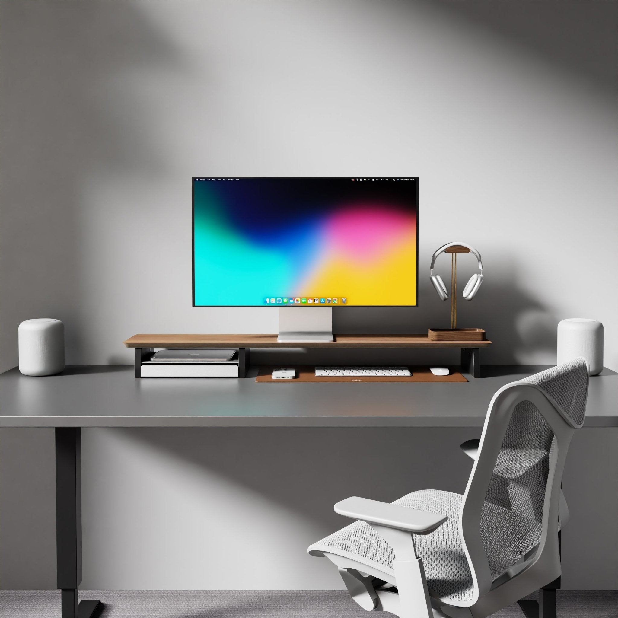 modern desk setup with the Raico Desk Shelf for monitor stand in walnut wood and a coordinating brown leather desk mat. A great alternative to Grovemade desk risers and is made from 15-ply Premium Walnut Hardwood and cork feet for both functionality