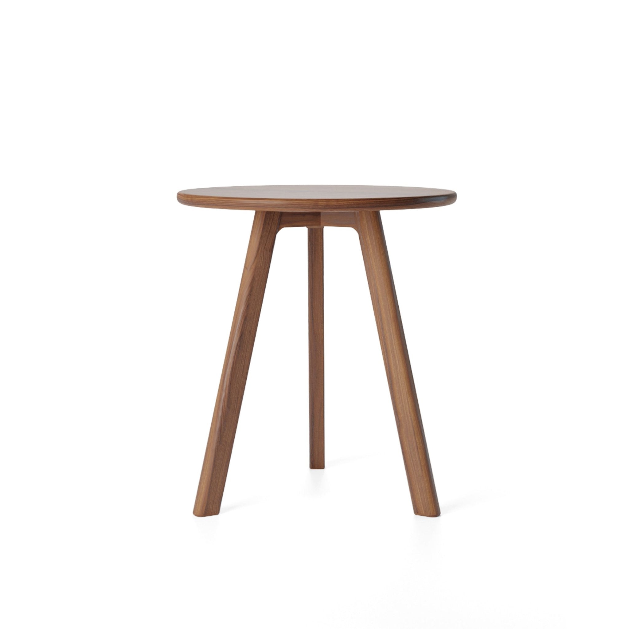 This round side table is a modern and stylish addition to any room. It features a round, walnut design and is made of dark wood. The small size of the table makes it perfect for use as a coffee table or occasional table. The simple, wooden design is enhanced by its cherry accent and handmade construction. Add a touch of sophistication to your space with this versatile and functional side table