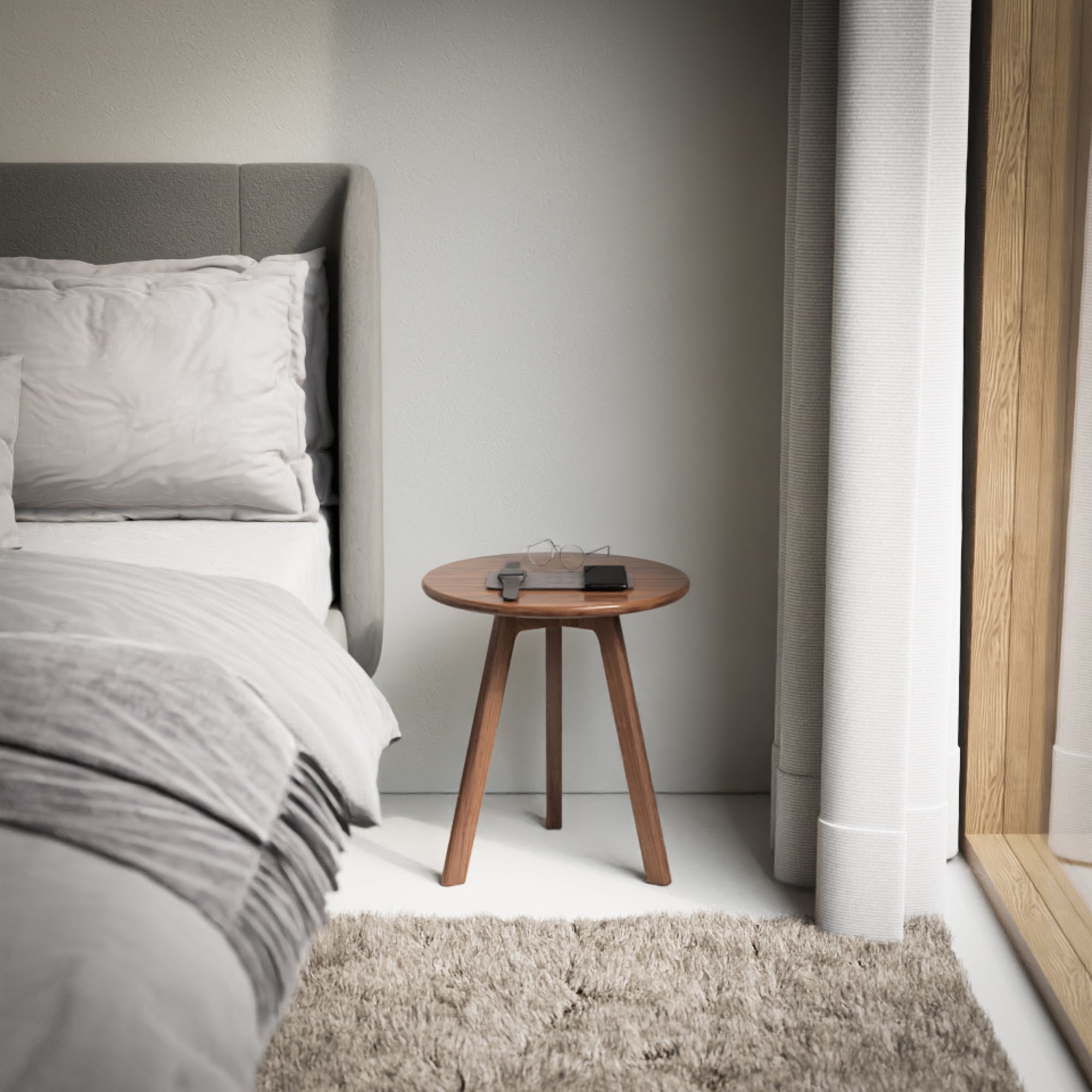 This round bedside table is a stylish and functional addition to any bedroom. Its round, walnut design is made of dark wood and is perfect for holding a lamp or other bedside essentials. Its small size and simple, wooden design are enhanced by its cherry accent and handmade construction. Add a touch of sophistication to your bedroom with this versatile and practical bedside table